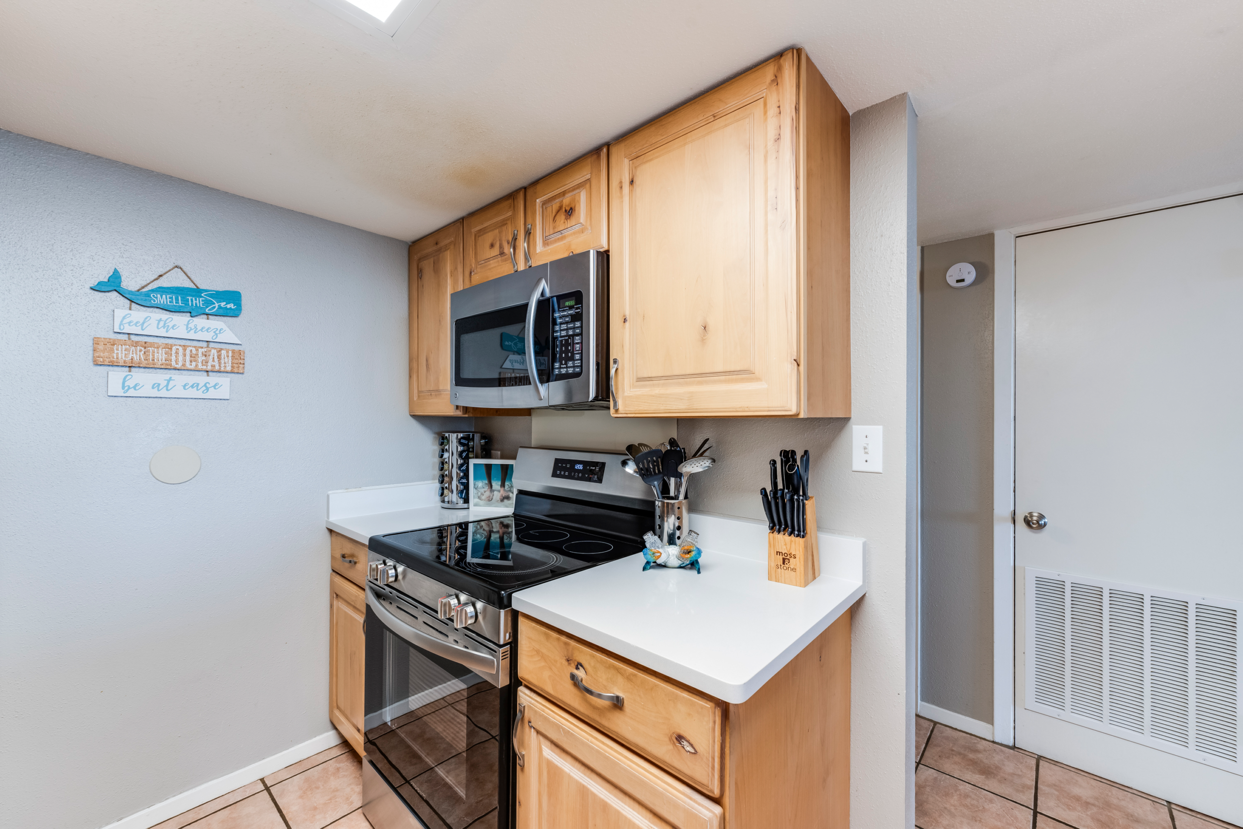 Fully equipped kitchen with full-size appliances and dining for groups in Port Aransas condo