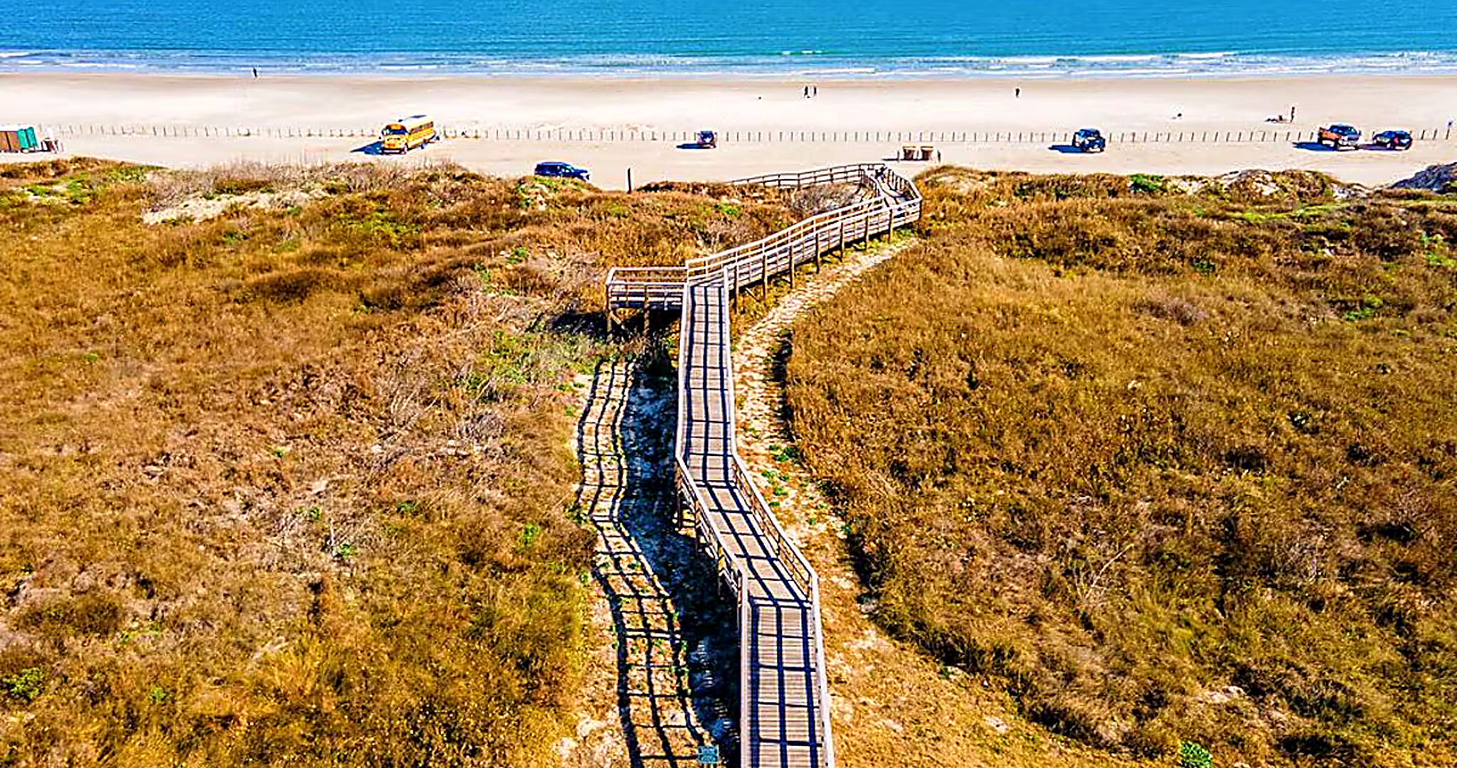 Boardwalk from Sea Sands condos leading through dunes to Port Aransas beach and Gulf waters